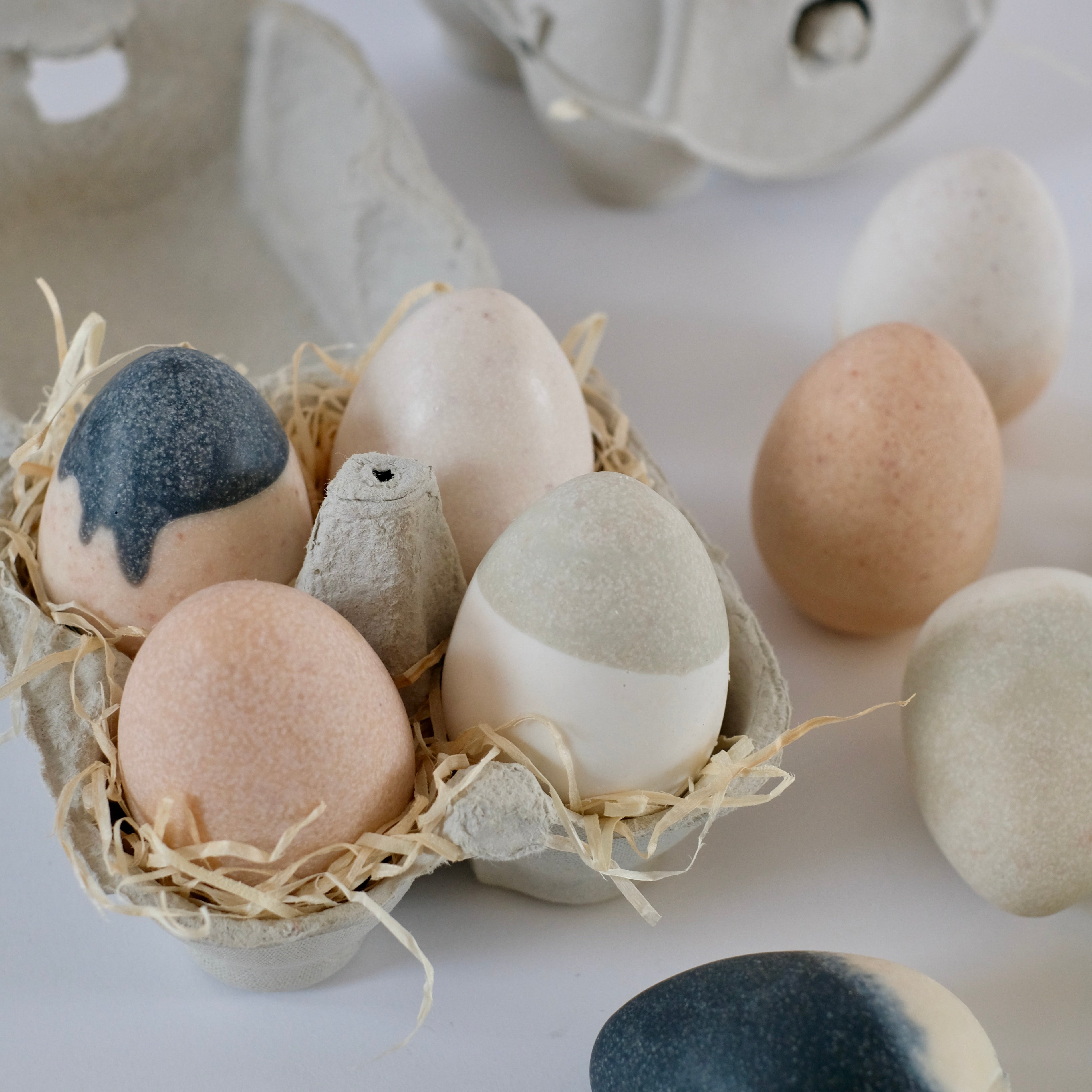 An arrangement of dook's products decorated with creme paper on the grey background.