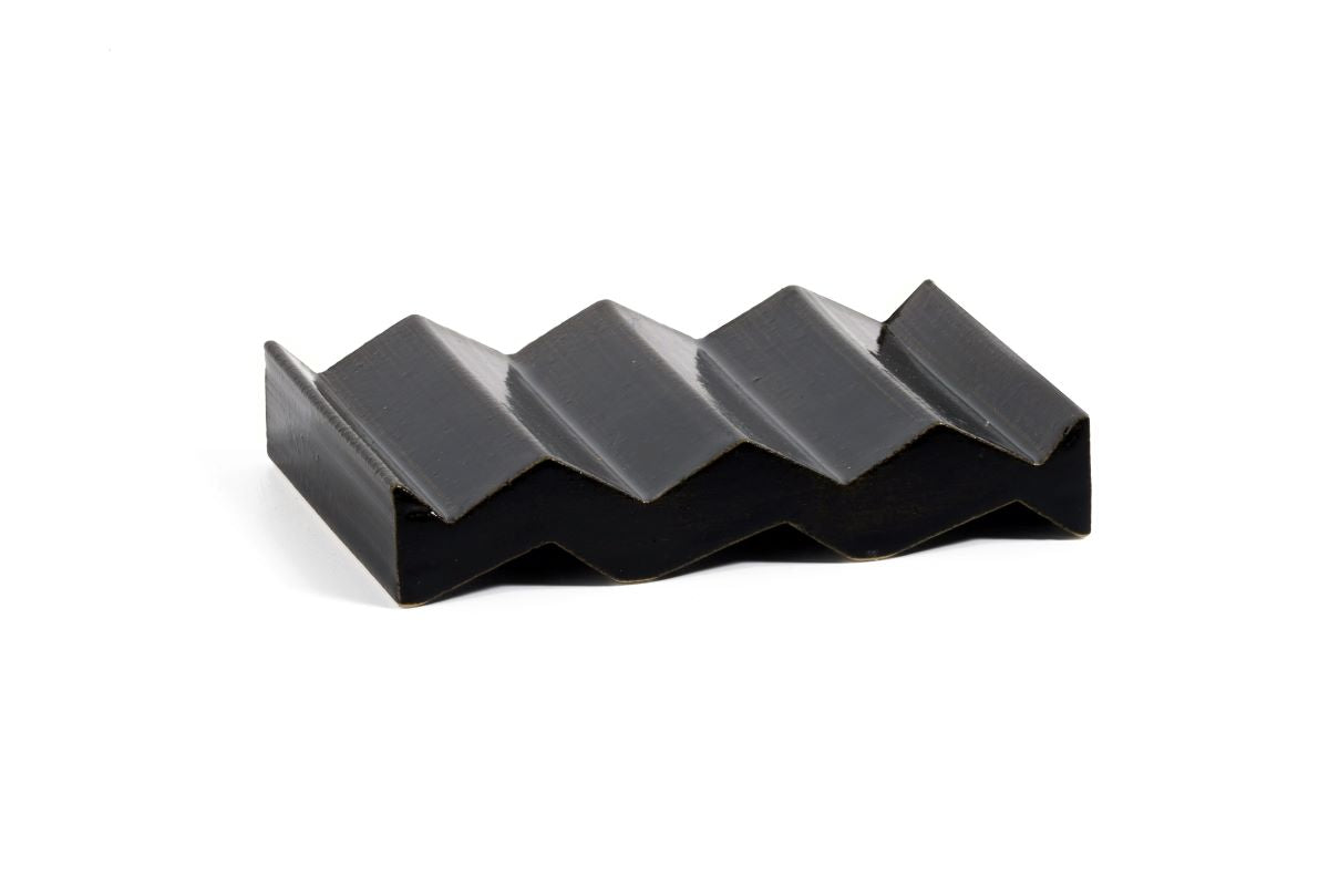 Black zig-zag shaped OBA Ceramic soap dish on the white background - side view.