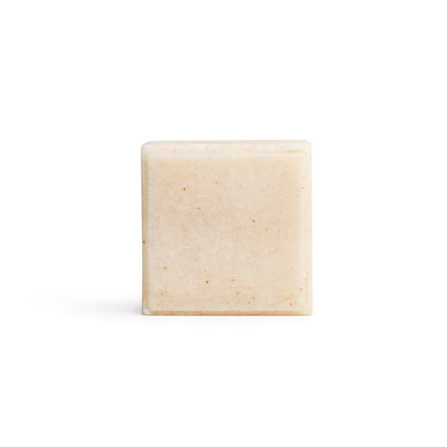 A bare square shampoo bar on the white background.