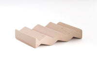 Rose light pink zig-zag shaped OBA Ceramic soap dish on the white background side angle view.