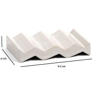 White zig-zag shaped OBA Ceramic soap dish on the white background with dimensions: 1.6 cm x 6.4 cm x 9.2 cm.