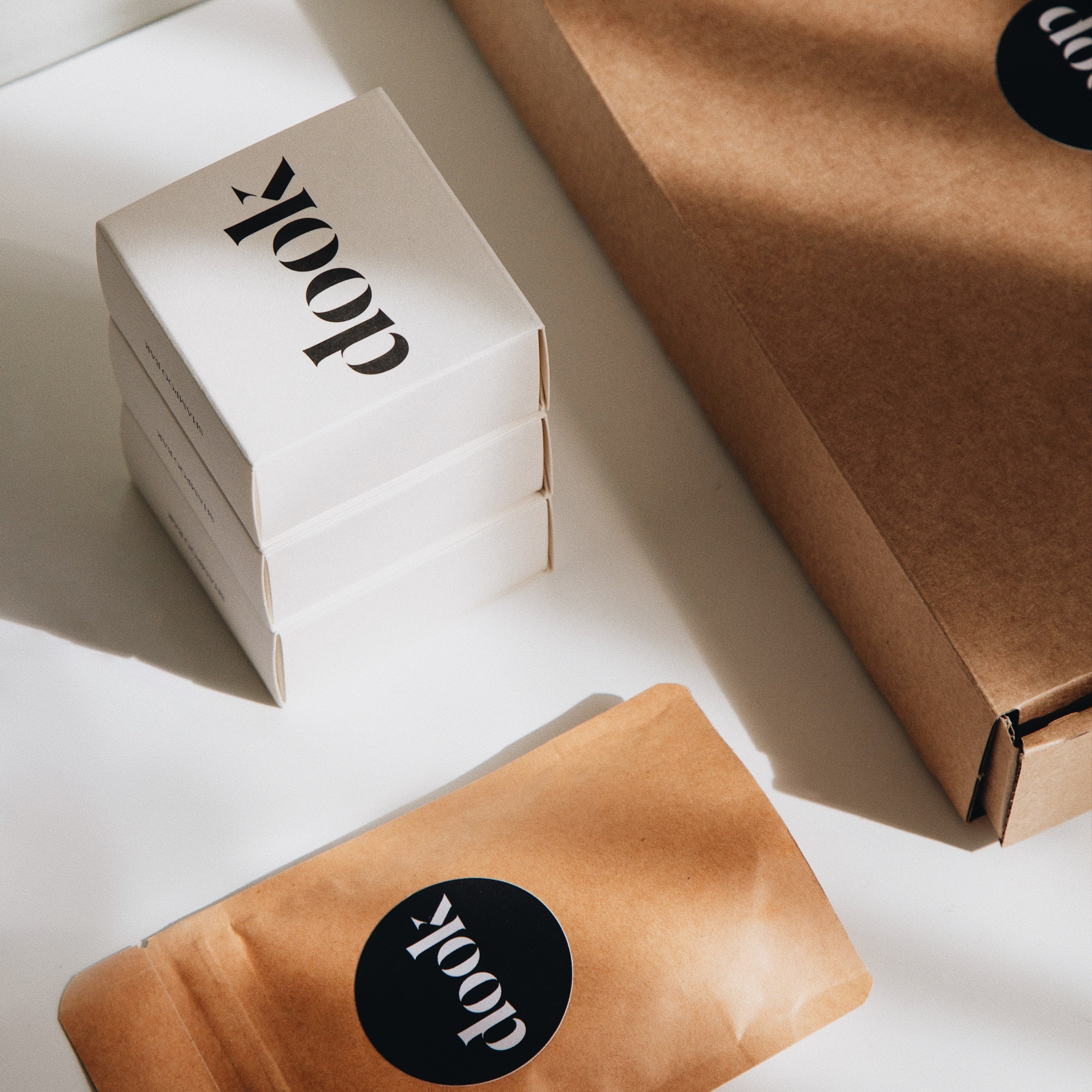 Subscription box offer of three shampoos and a small dook product next to a brown box.