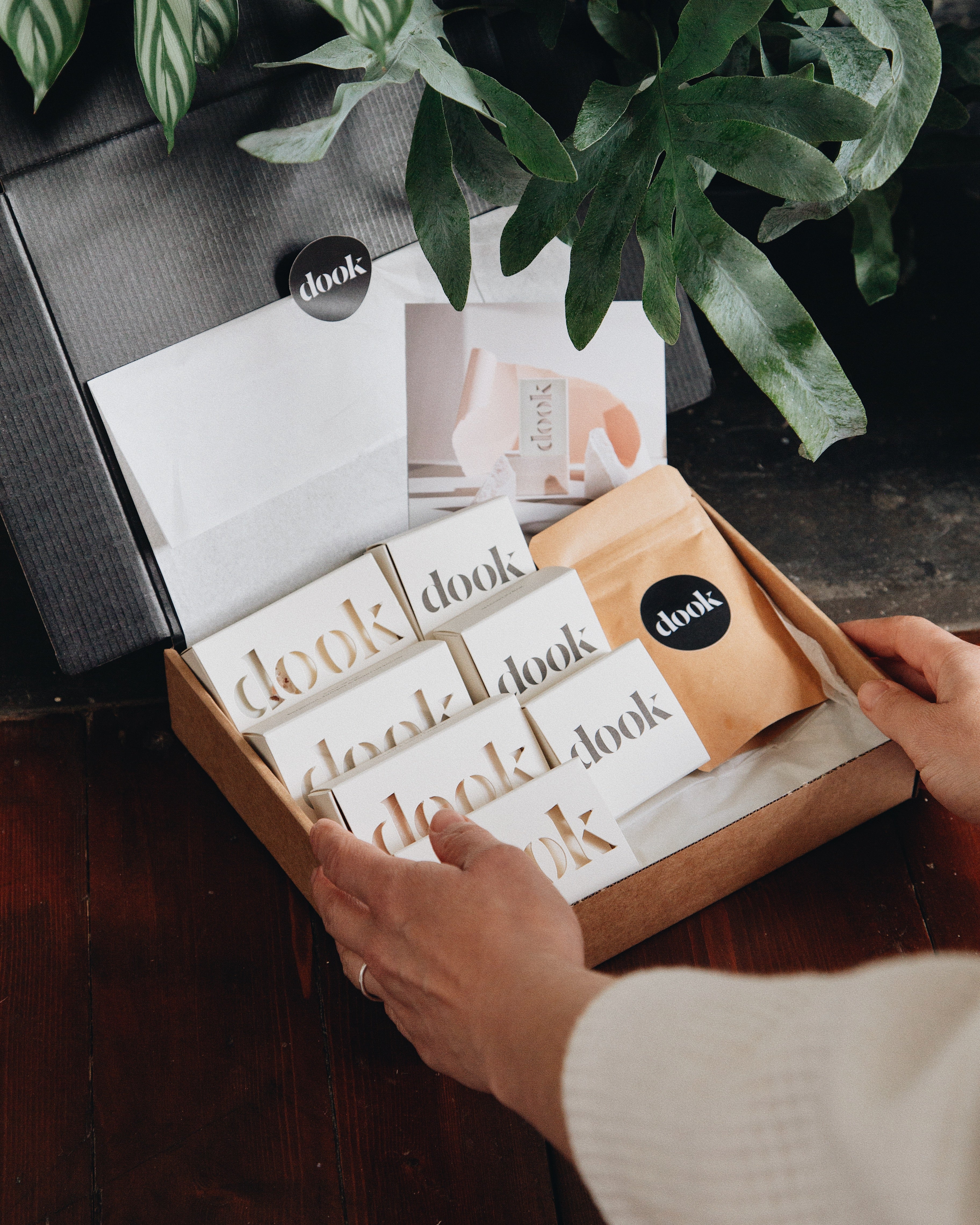 A person holding a soap subscription box.