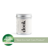 Tin of a dook bath salts with a logo label on the white background labeled with beauty shortlist awards 2023 for best eco lifestyle winner badge.