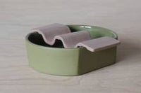 Porcelain soap dish in two pieces put together - moss green base and dusty pink wavy top.