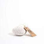 Volcanic lava rock white pumice stone with a label on the white background.