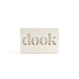 Bar soap in a plastic-free box with dook logo. 