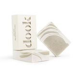 Three handmade bar soaps with green and creamy white pattern on the white background.