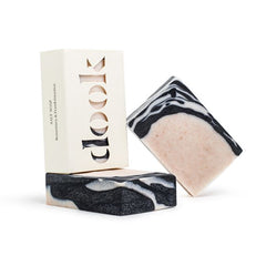 Three handmade, rosemary and frankincense bar soaps. Handmade designed with charcoal and white irregular pattern filling the top left corner. Two bar soaps are without packaging and one in is in a box with the dook logo.