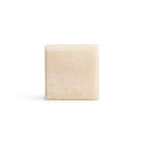 A bare square shampoo bar on the white background.