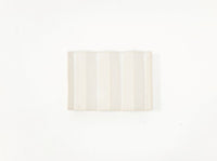 White zig-zag shaped OBA Ceramic soap dish on the white background top view.