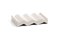 White zig-zag shaped OBA Ceramic soap dish on the white background side view.