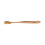 A wooden toothbrush on the white background.